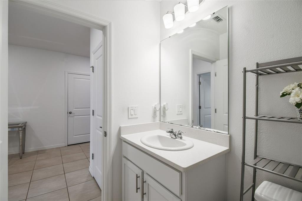 136 Citrine Loop Kissimmee, FL 34758 - Photo 15 of 28 a bathroom with a sink toilet and shower