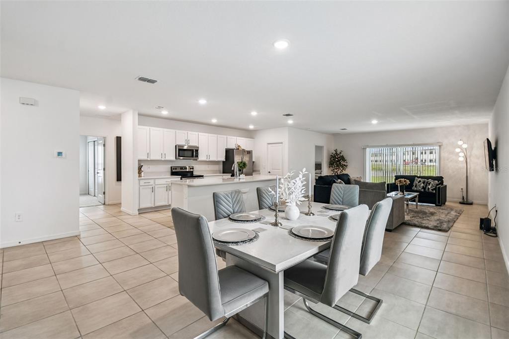 136 Citrine Loop Kissimmee, FL 34758 - Photo 5 of 28 a view of a dining room with furniture