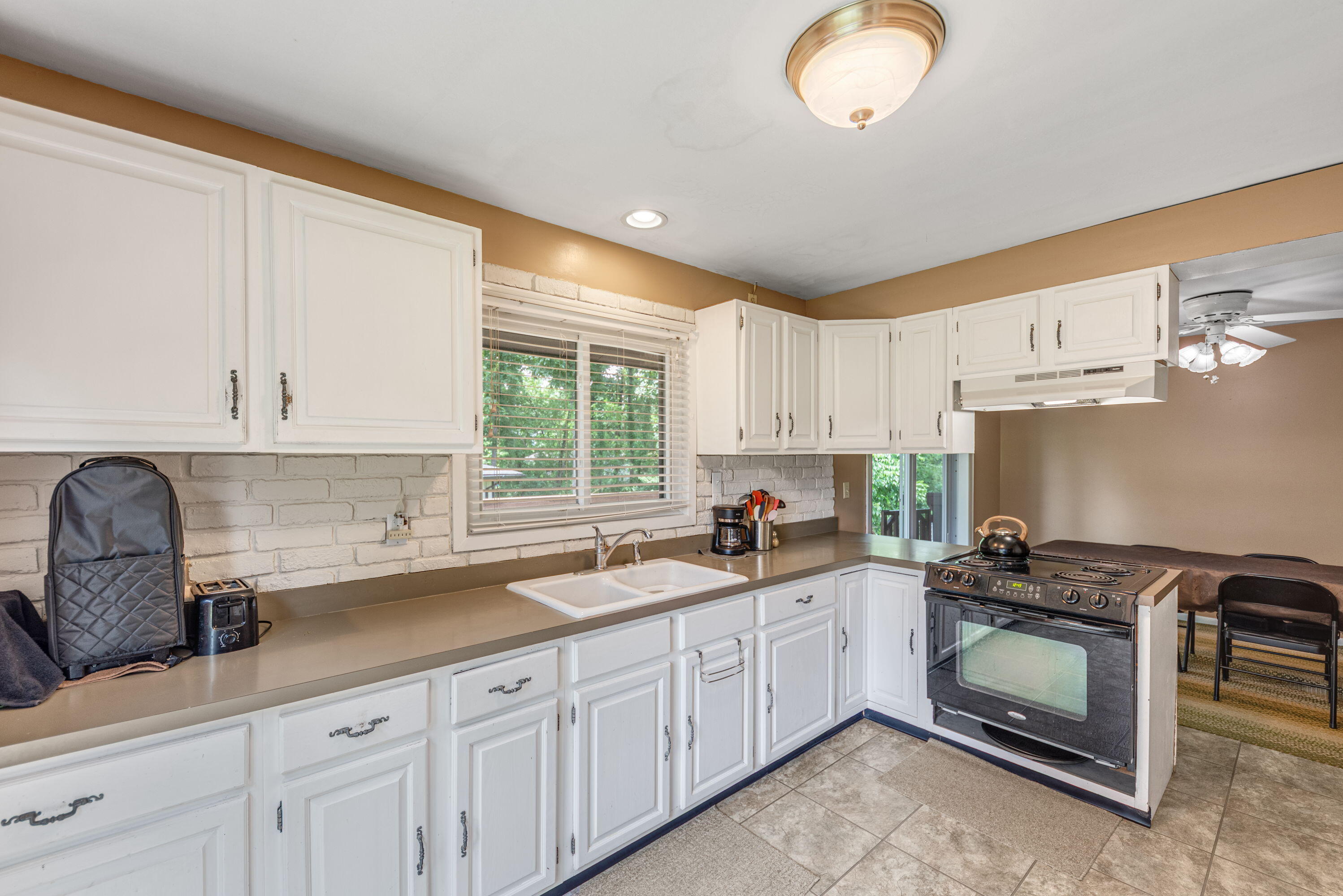 2337 Four Seasons Parkway Crown Point, IN 46307 - Photo 4 of 18 a kitchen with sink cabinets and window