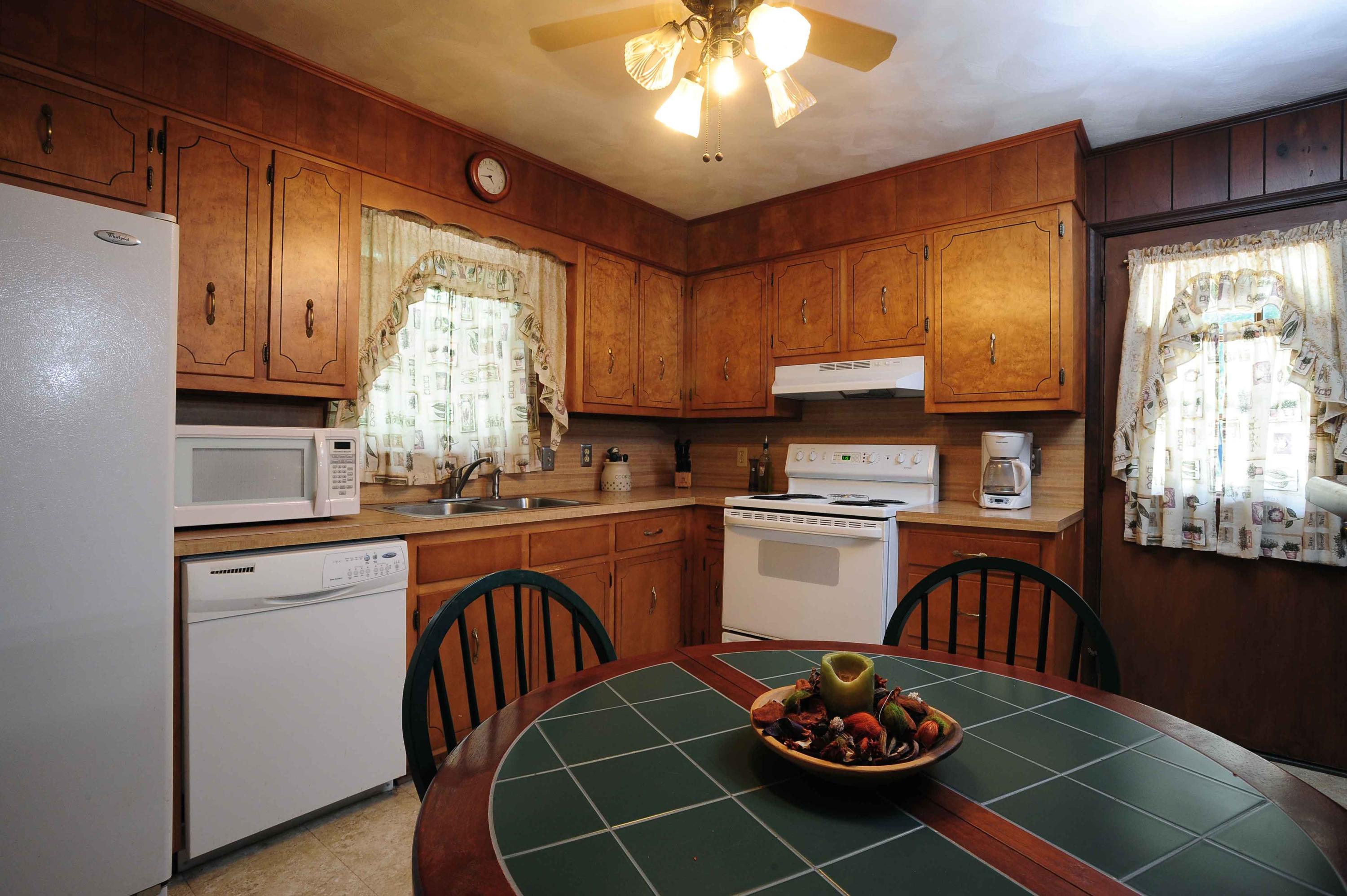 302 Pin Oak Drive Blue Ridge, VA 24064 - Photo 12 of 18 a kitchen with a sink cabinets and window