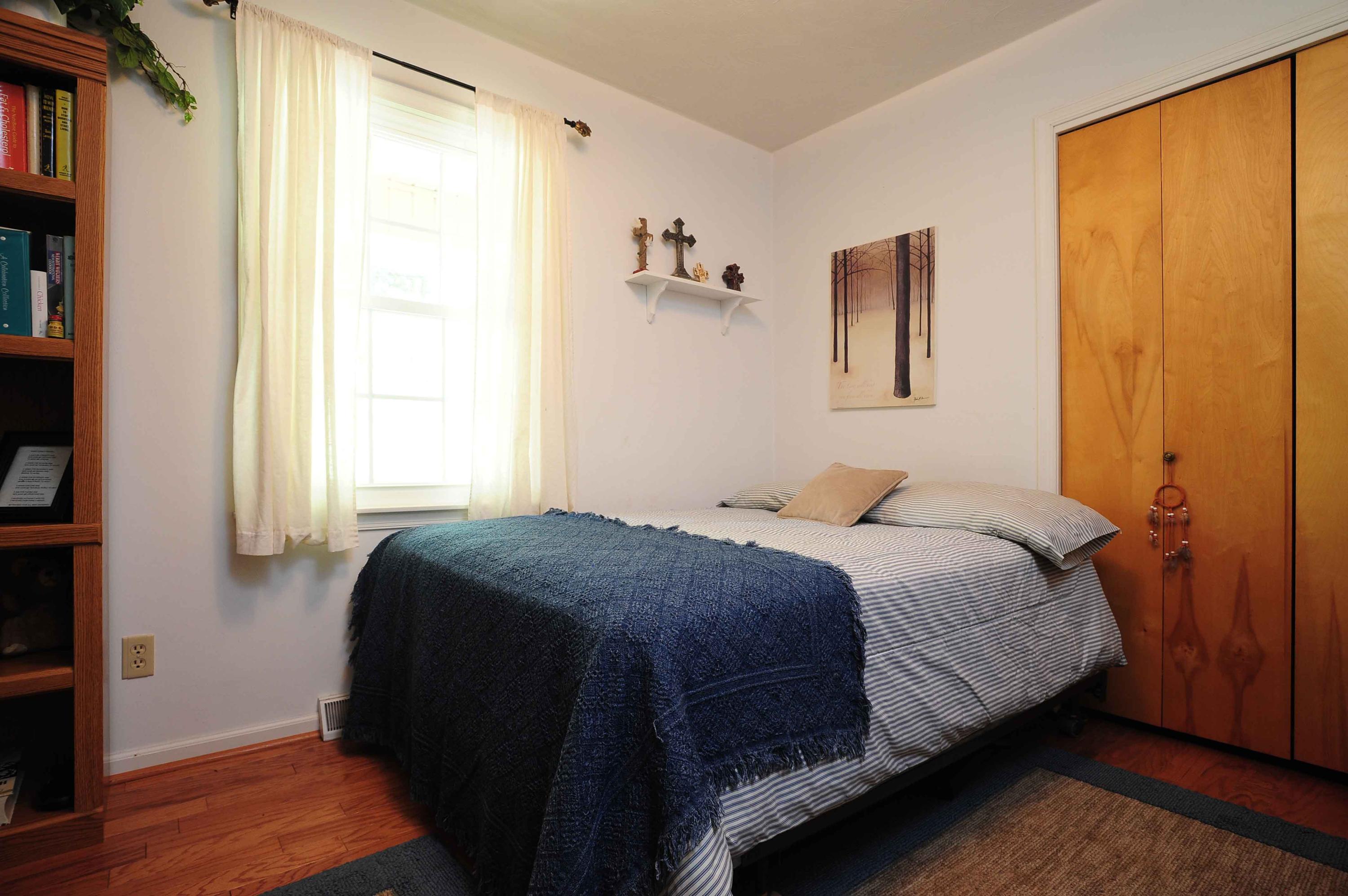 302 Pin Oak Drive Blue Ridge, VA 24064 - Photo 15 of 18 a bedroom with a bed and a window