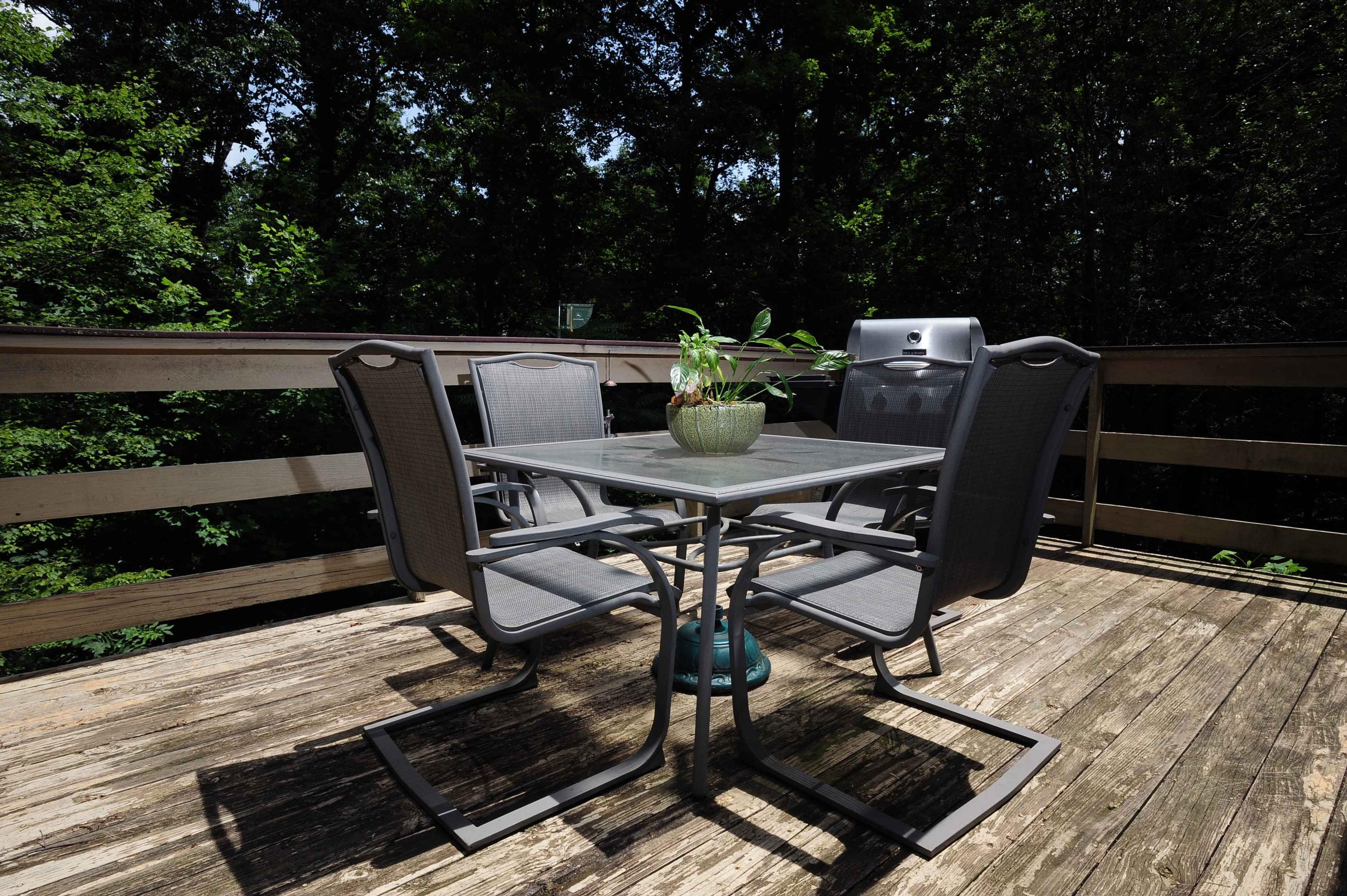 302 Pin Oak Drive Blue Ridge, VA 24064 - Photo 4 of 18 a view of a chairs and table on the deck
