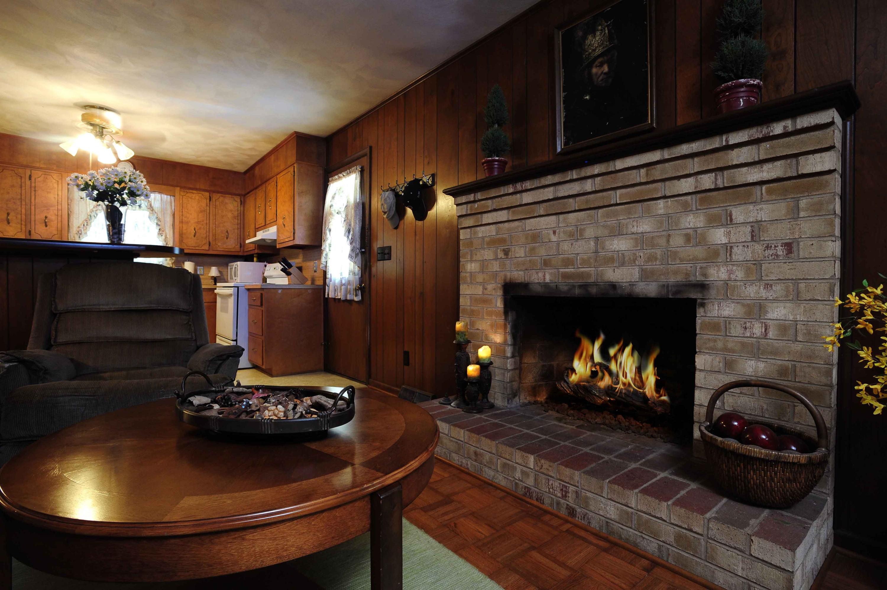 302 Pin Oak Drive Blue Ridge, VA 24064 - Photo 8 of 18 a kitchen with a fireplace and a stove