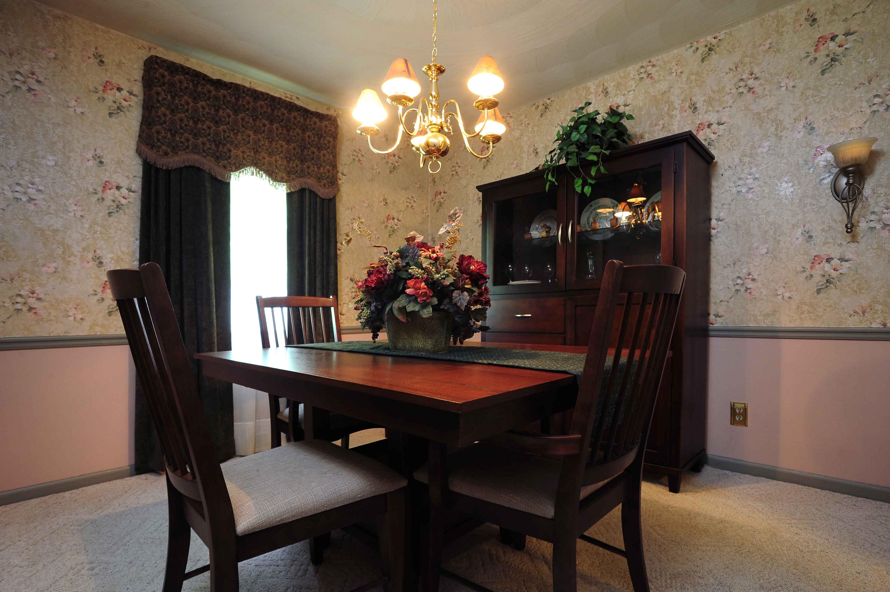 302 Pin Oak Drive Blue Ridge, VA 24064 - Photo 9 of 18 a dining room with furniture and chandelier