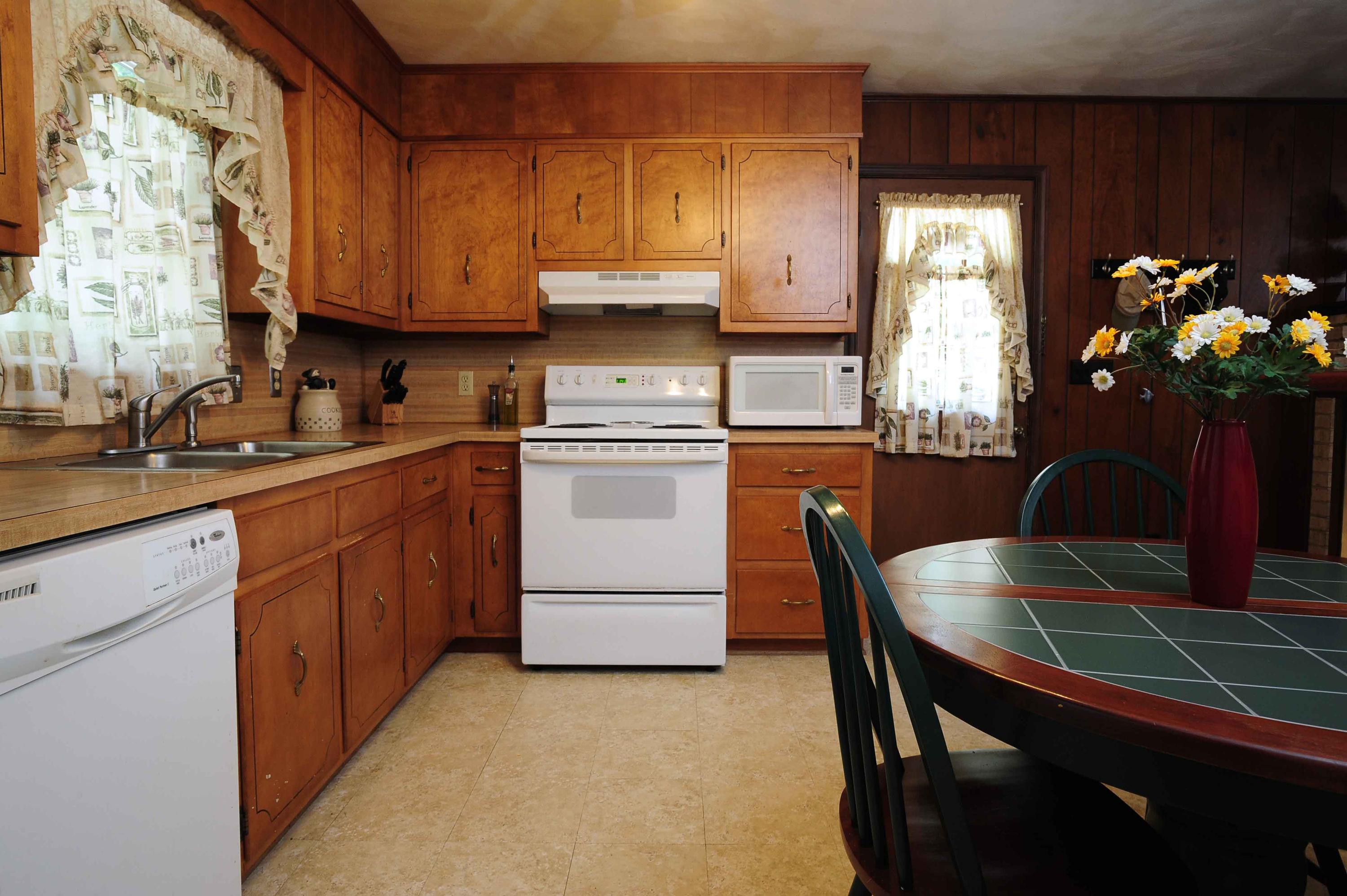 302 Pin Oak Drive Blue Ridge, VA 24064 - Photo 10 of 18 a kitchen with a sink stove and cabinets