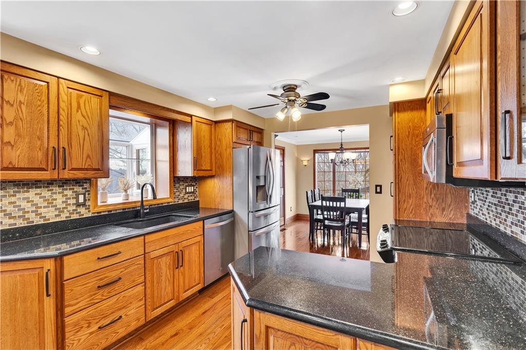 210 Gotham Lane Monroeville, PA 15146 - Photo 12 of 31 a kitchen with stainless steel appliances granite countertop a sink and cabinets