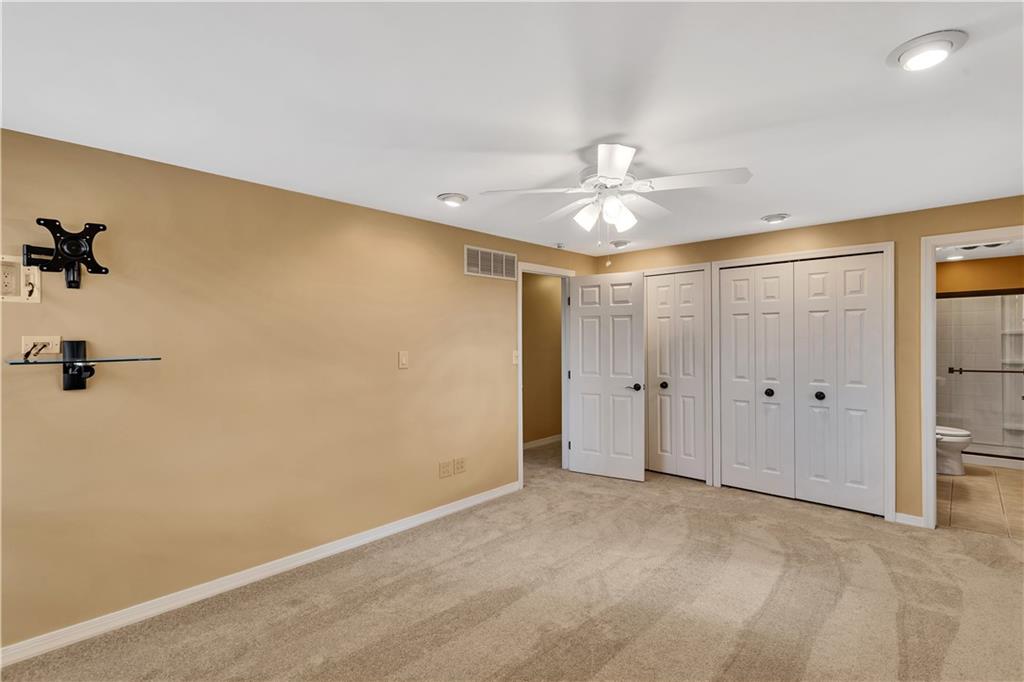 210 Gotham Lane Monroeville, PA 15146 - Photo 18 of 31 wooden floor in an empty room with a ceiling fan
