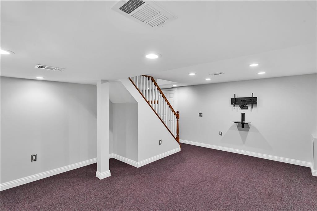 210 Gotham Lane Monroeville, PA 15146 - Photo 26 of 31 an empty room with a ceiling fan and windows
