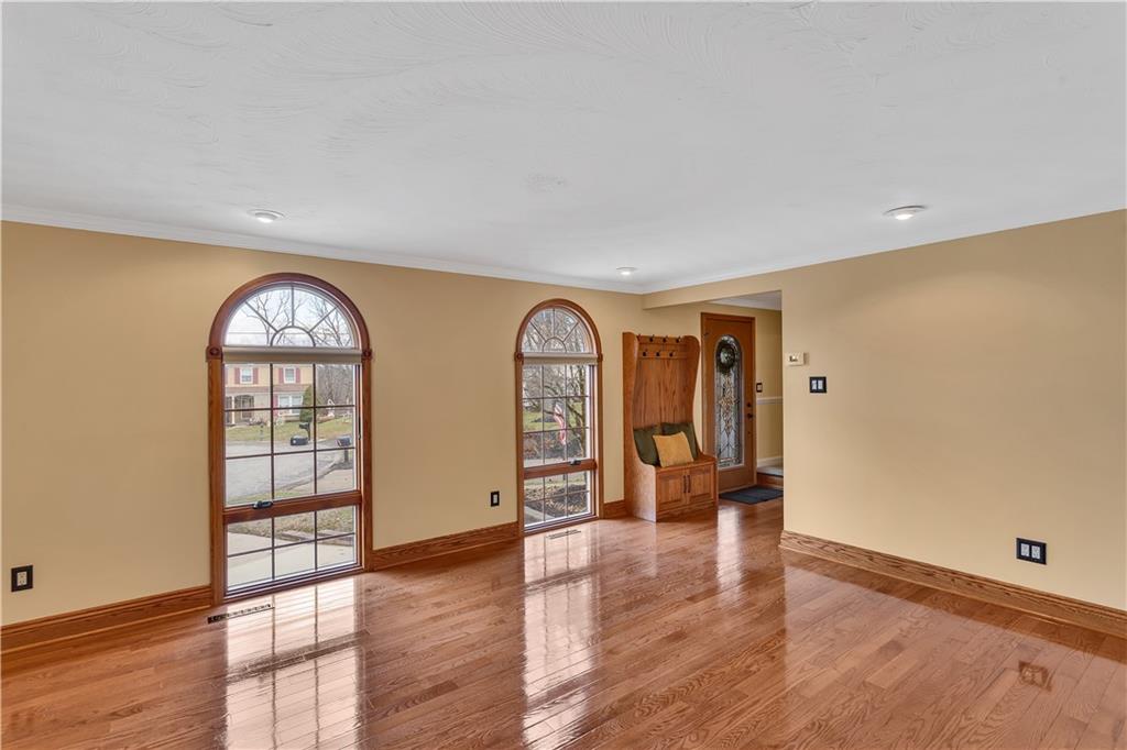 210 Gotham Lane Monroeville, PA 15146 - Photo 5 of 31 wooden floor in an empty room with a window