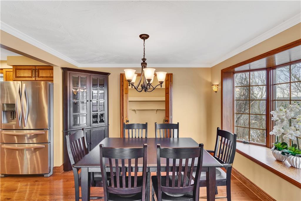 210 Gotham Lane Monroeville, PA 15146 - Photo 9 of 31 a view of a dining room with furniture window and wooden floor