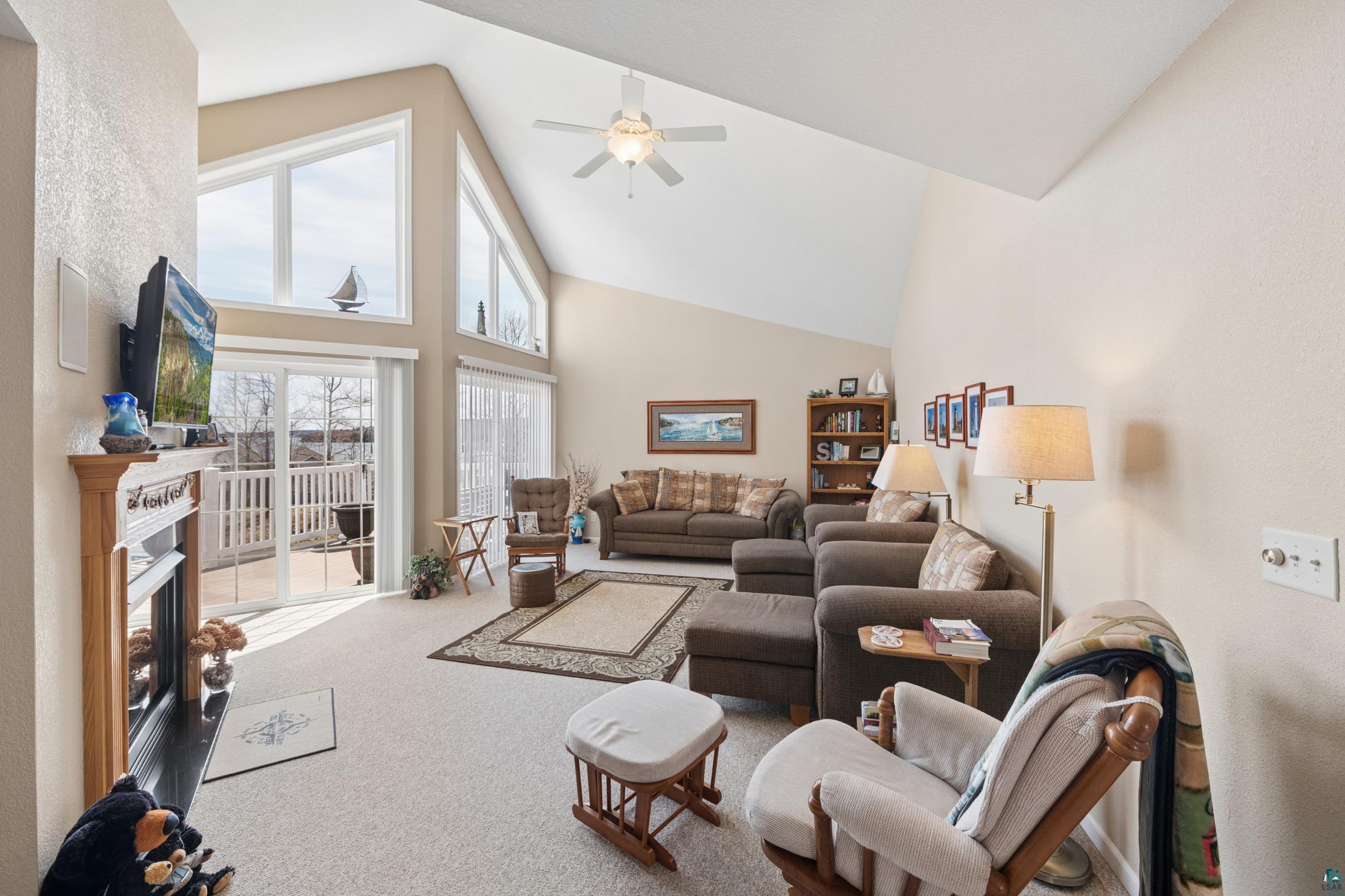 34590 Bay View Road, Unit 801 Bayfield, WI 54814 - Photo 7 of 36 Vaulted ceilings showcasing a ceiling fan and upper windows provide height