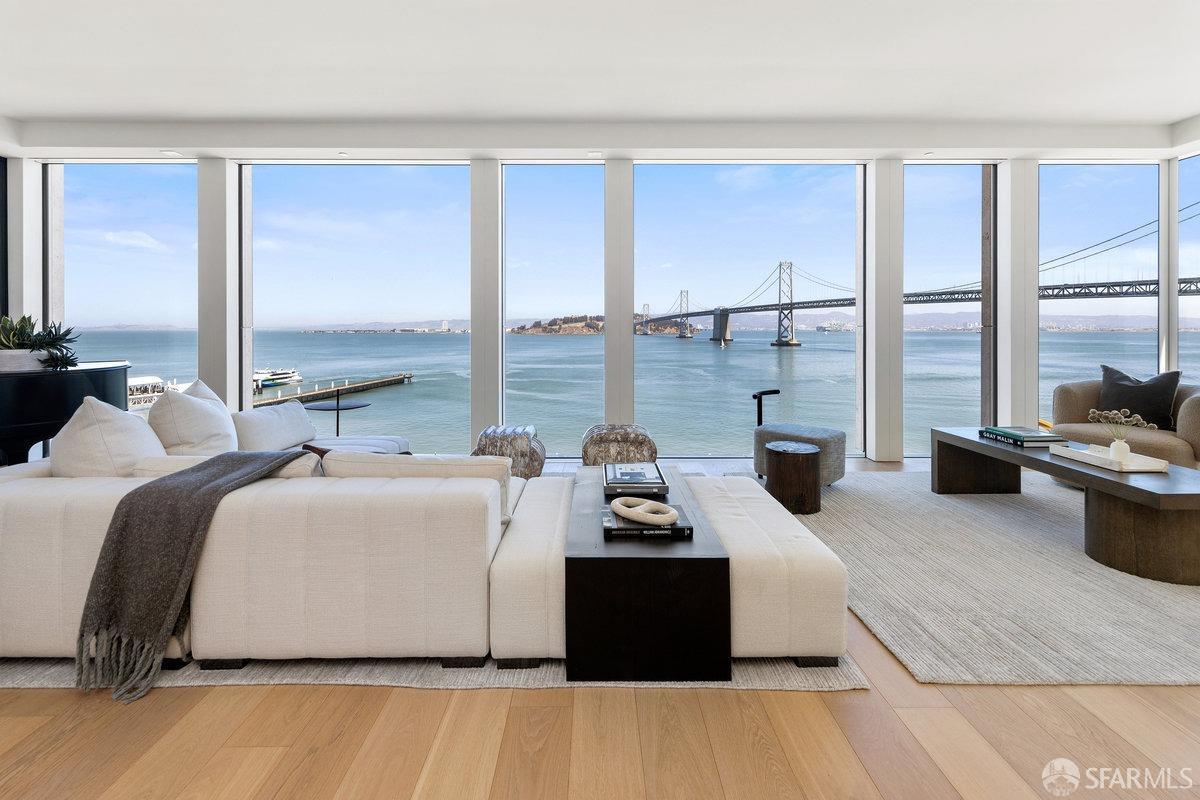 1 Steuart Lane, Unit 1001 San Francisco, CA 94105 - Photo 6 of 60 a living room with furniture floor to ceiling window and a table