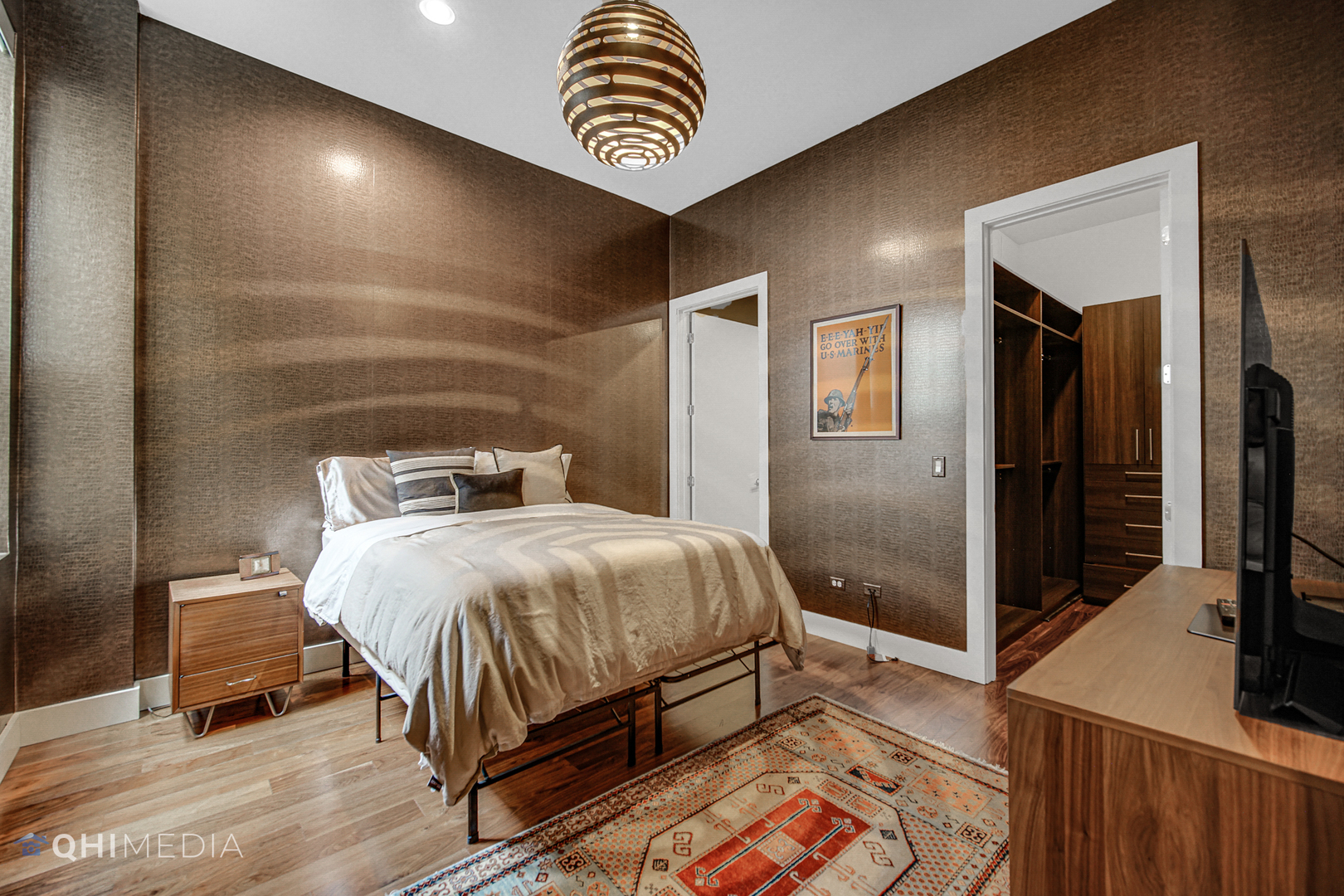 16 North Carpenter Street, Unit PHN Chicago, IL 60607 - Photo 16 of 25 a bedroom with a bed and a tv on table