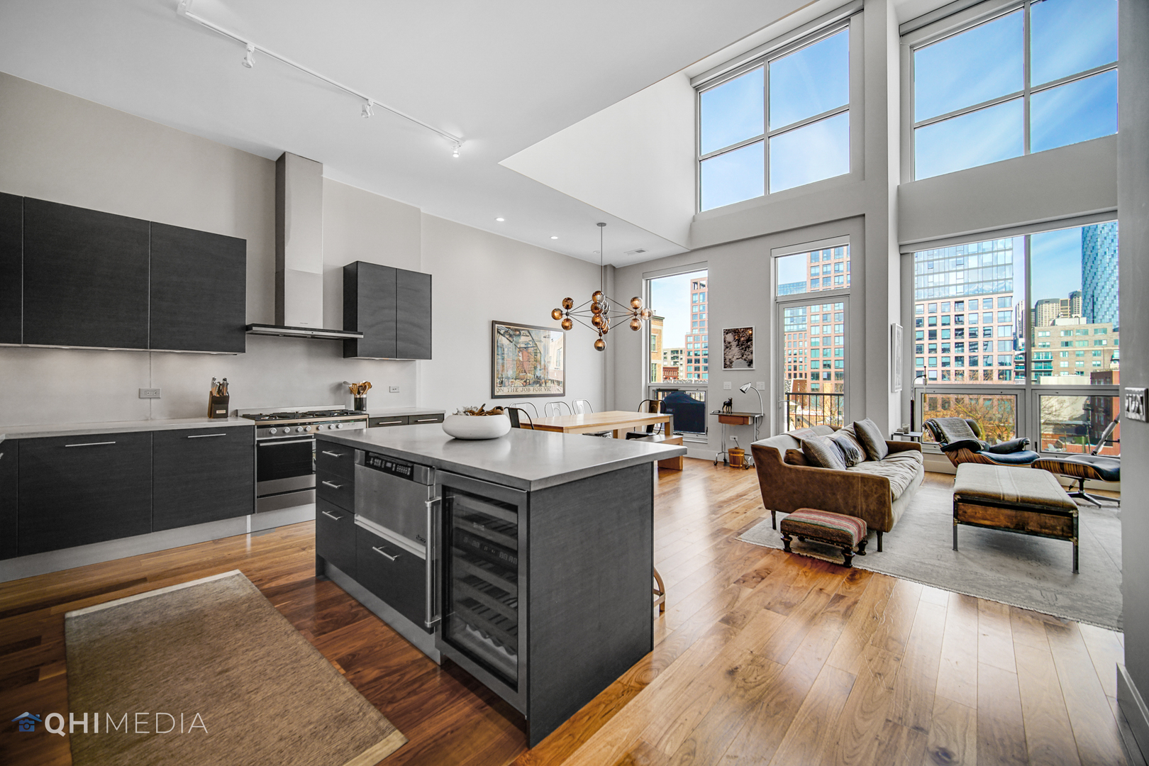 16 North Carpenter Street, Unit PHN Chicago, IL 60607 - Photo 2 of 25 a large kitchen with stainless steel appliances and large window