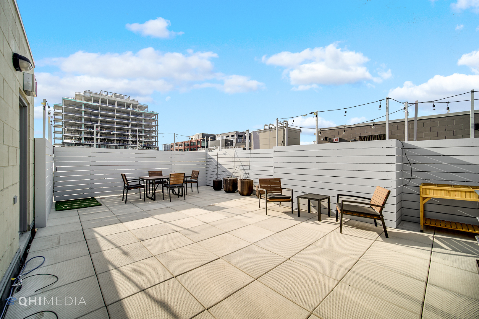 16 North Carpenter Street, Unit PHN Chicago, IL 60607 - Photo 21 of 25 a roof deck with table and chairs