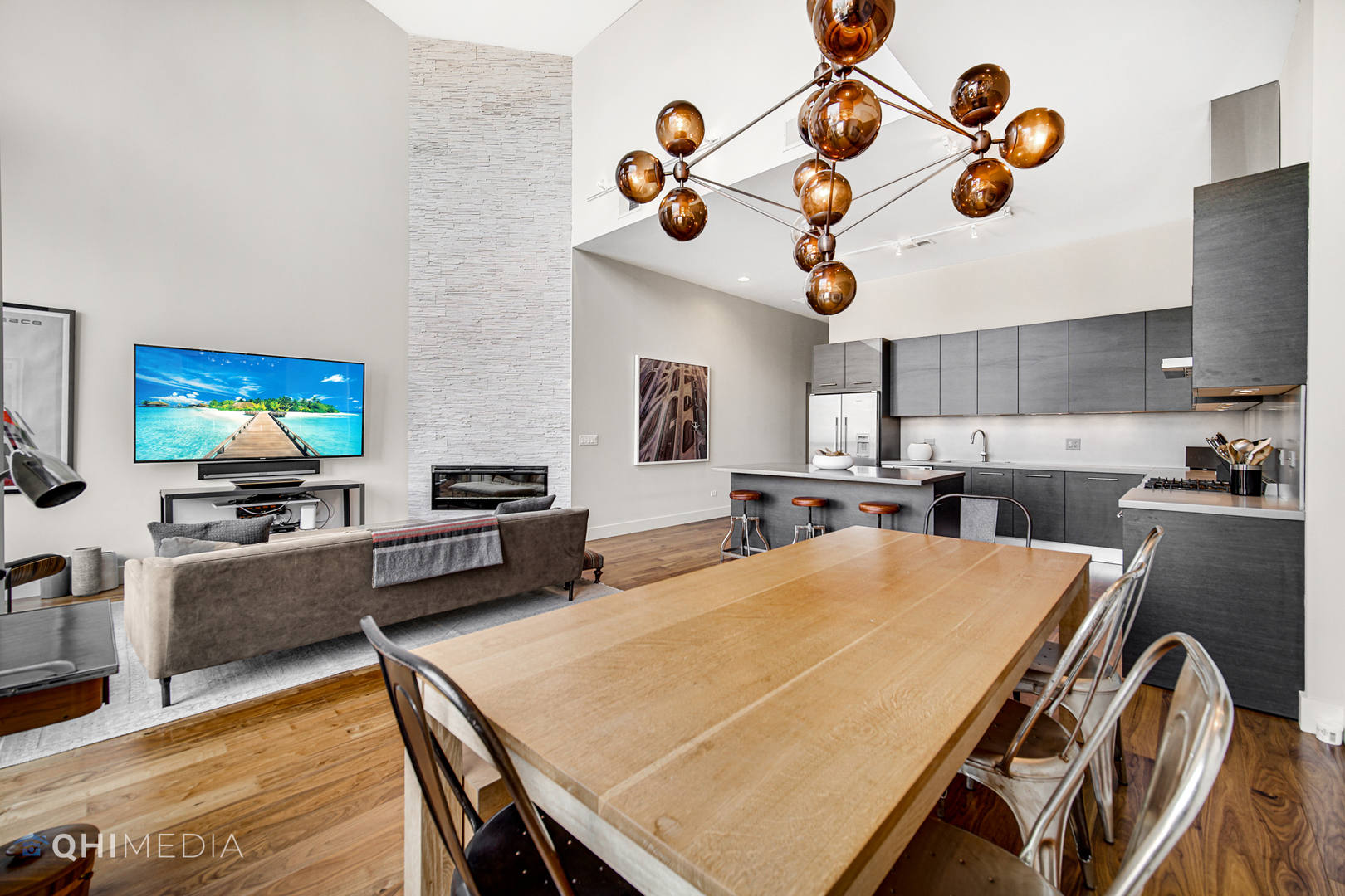 16 North Carpenter Street, Unit PHN Chicago, IL 60607 - Photo 5 of 25 a living room with furniture and flat screen tv