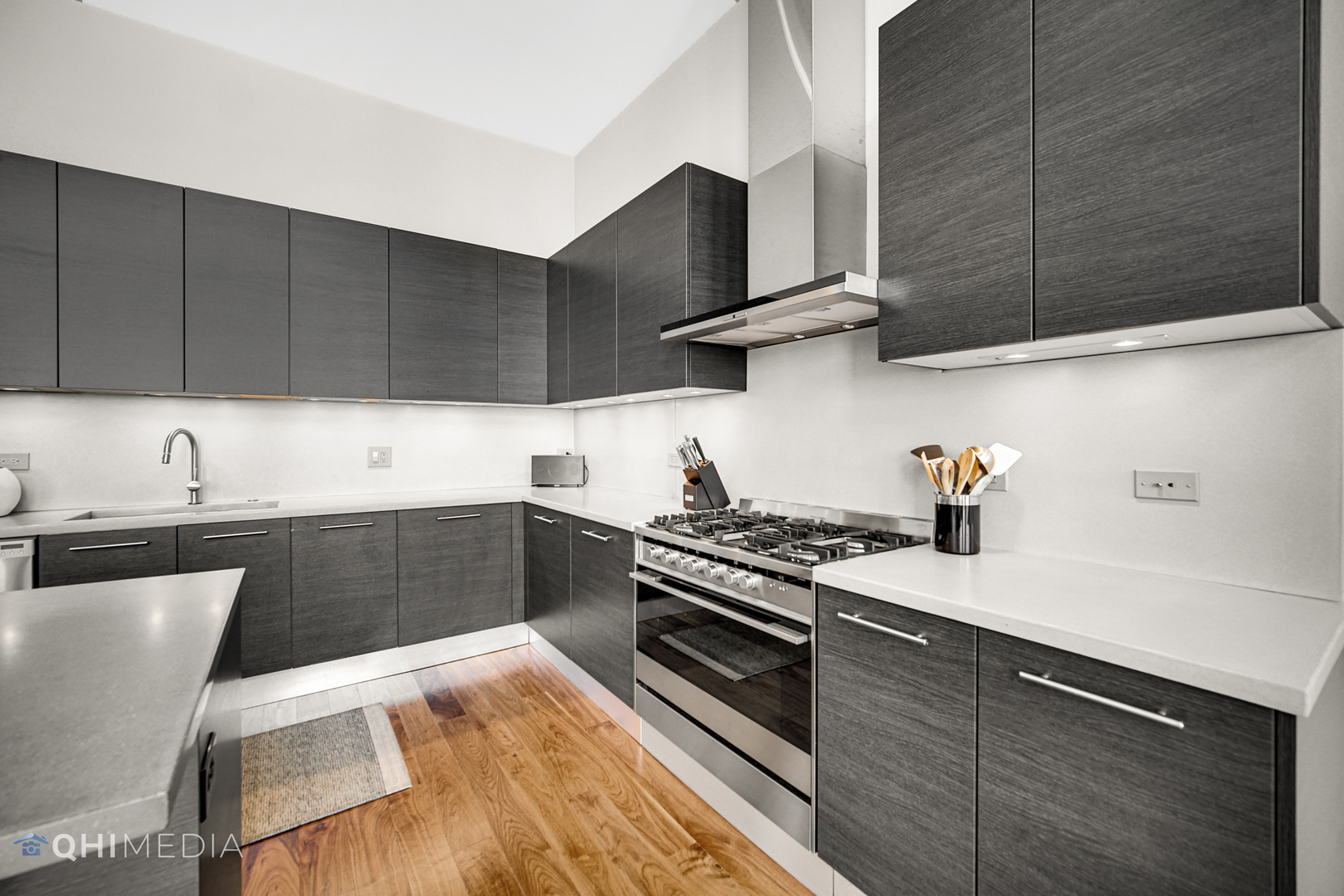 16 North Carpenter Street, Unit PHN Chicago, IL 60607 - Photo 9 of 25 a kitchen with stainless steel appliances a sink dishwasher and a stove top oven