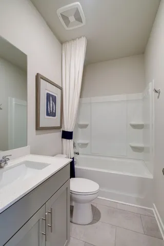 a bathroom with a sink a toilet and a bathtub