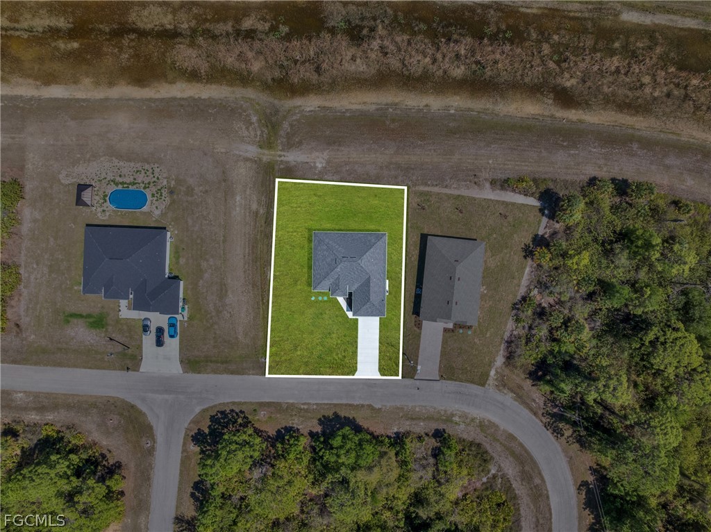 6029 Keystone Circle LaBelle, FL 33935 - Photo 49 of 50 a front view of a house with a yard