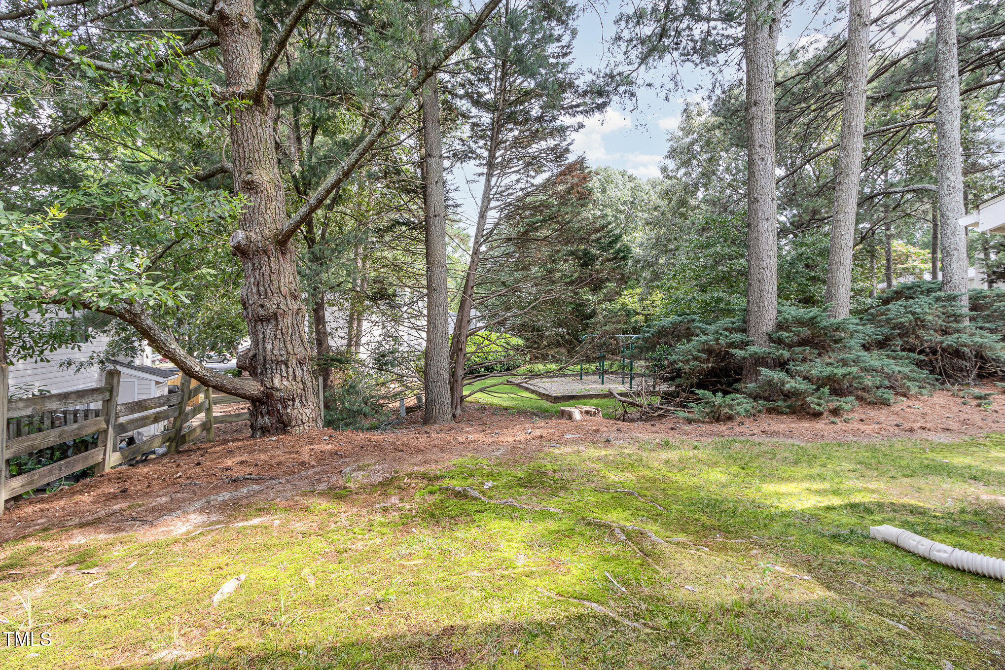 7708 Falcon Rest Circle Raleigh, NC 27615 - Photo 20 of 23 Overlooking playground area, mature trees and landscaping.