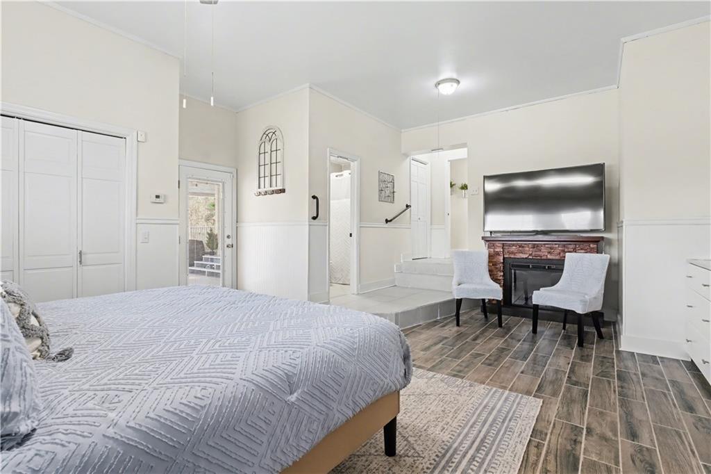 1833 Tom Odum Road Vidalia, GA 30474 - Photo 29 of 59 a spacious bedroom with a bed a table and a couch