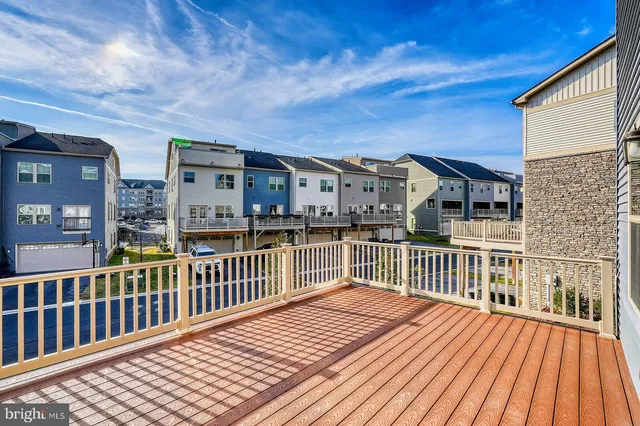 a view of a house with wooden deck