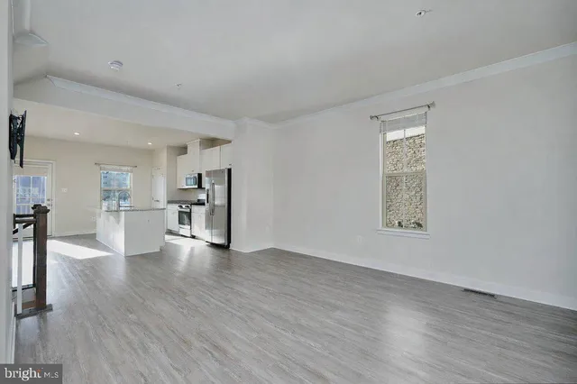 a white sink sitting under a bathroom mirror