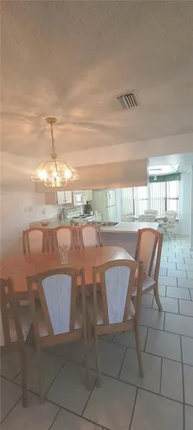 a workspace with a table and chairs