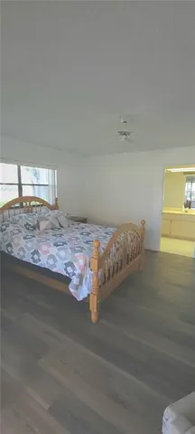 a bathroom with a granite countertop sink mirror and bathtub