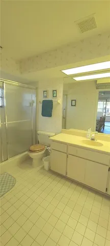 a view of walk in closet with empty room