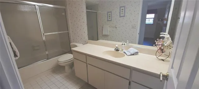 a bedroom with a bed and cabinets