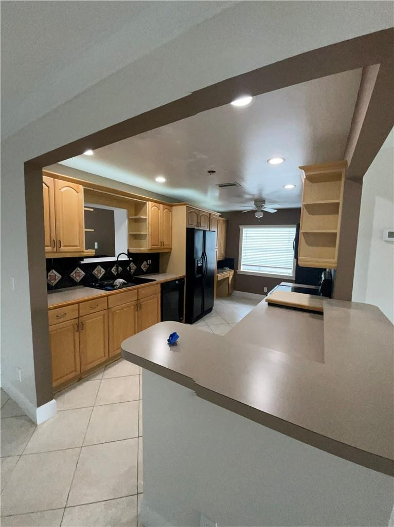 22813 Southwest 54th Way Boca Raton, FL 33433 - Photo 9 of 10 a kitchen with a sink and white appliances