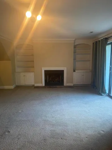 a view of an empty room and entryway