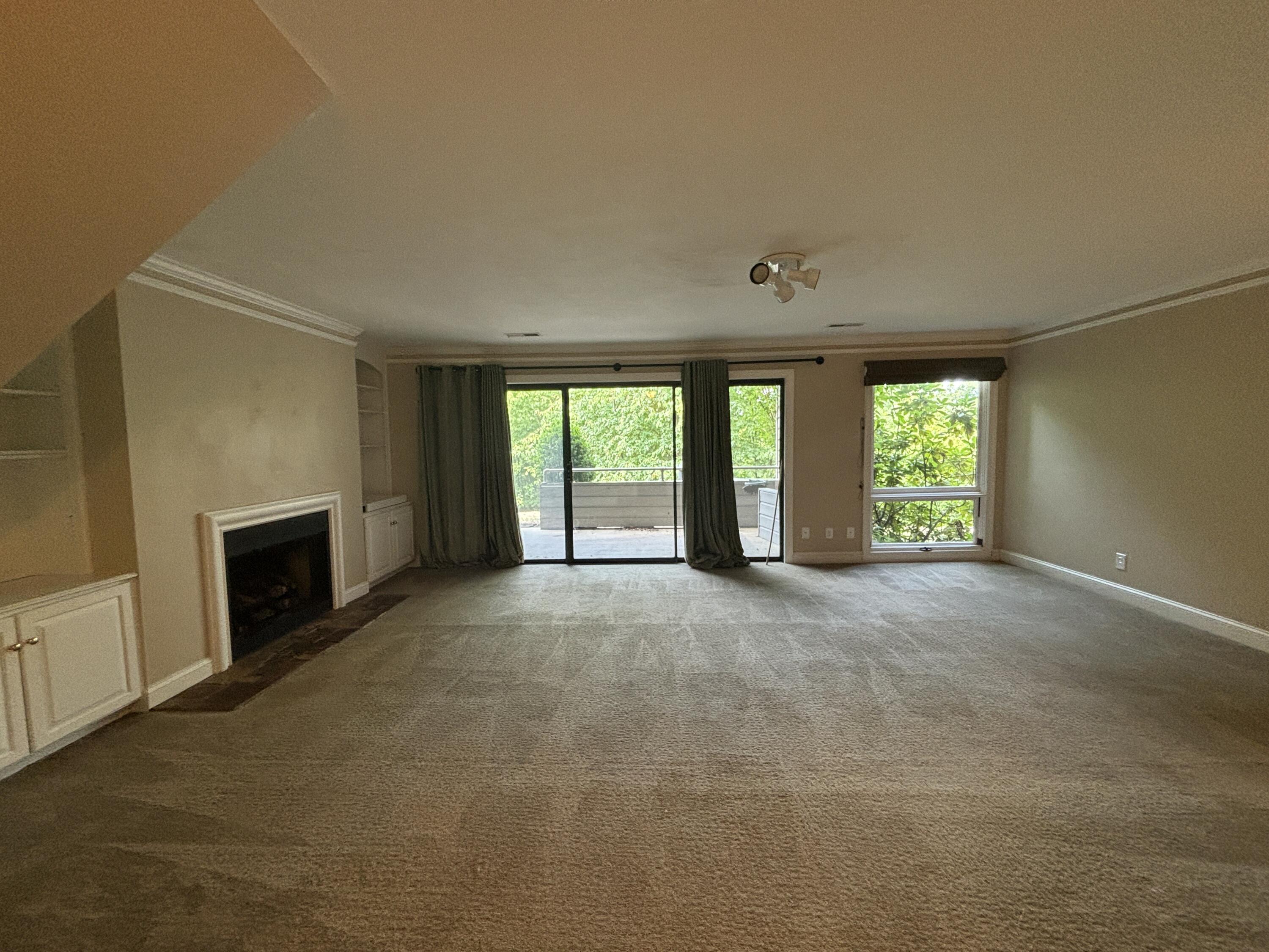 4978 Hunting Hills Circle Roanoke, VA 24018 - Photo 19 of 24 a view of an empty room with a fireplace and a window