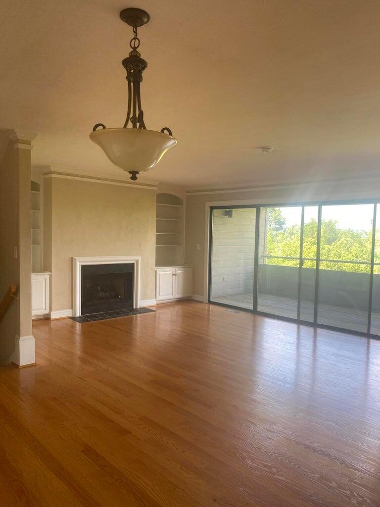 4978 Hunting Hills Circle Roanoke, VA 24018 - Photo 3 of 24 a view of empty room with wooden floor and fireplace