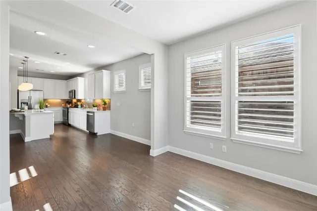 a view of a kitchen with furniture and a window