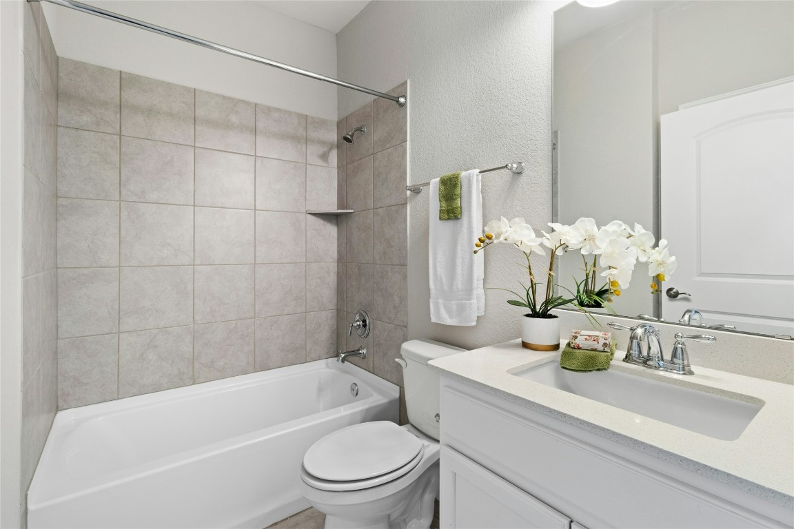 207 Longview Lane Georgetown, TX 78633 - Photo 20 of 37 a bathroom with a sink a toilet and shower