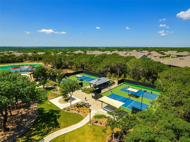 an aerial view of a pool patio swimming pool and outdoor seating