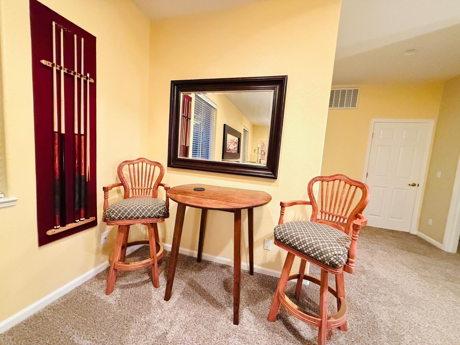 611 Sunrise Road Copperopolis, CA 95228 - Photo 19 of 29 a view of a hallway with chairs and a potted plant