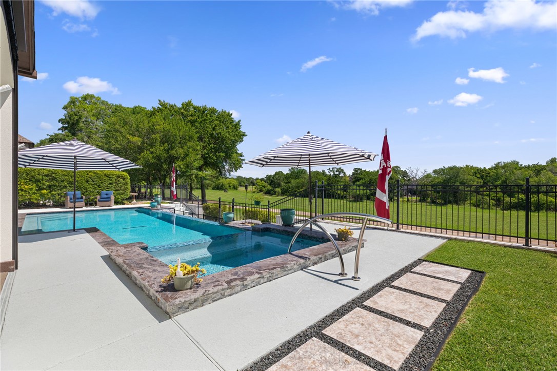2833 Persimmon Ridge Court Bryan, TX 77807 - Photo 48 of 50 a view of a patio with a table and chairs
