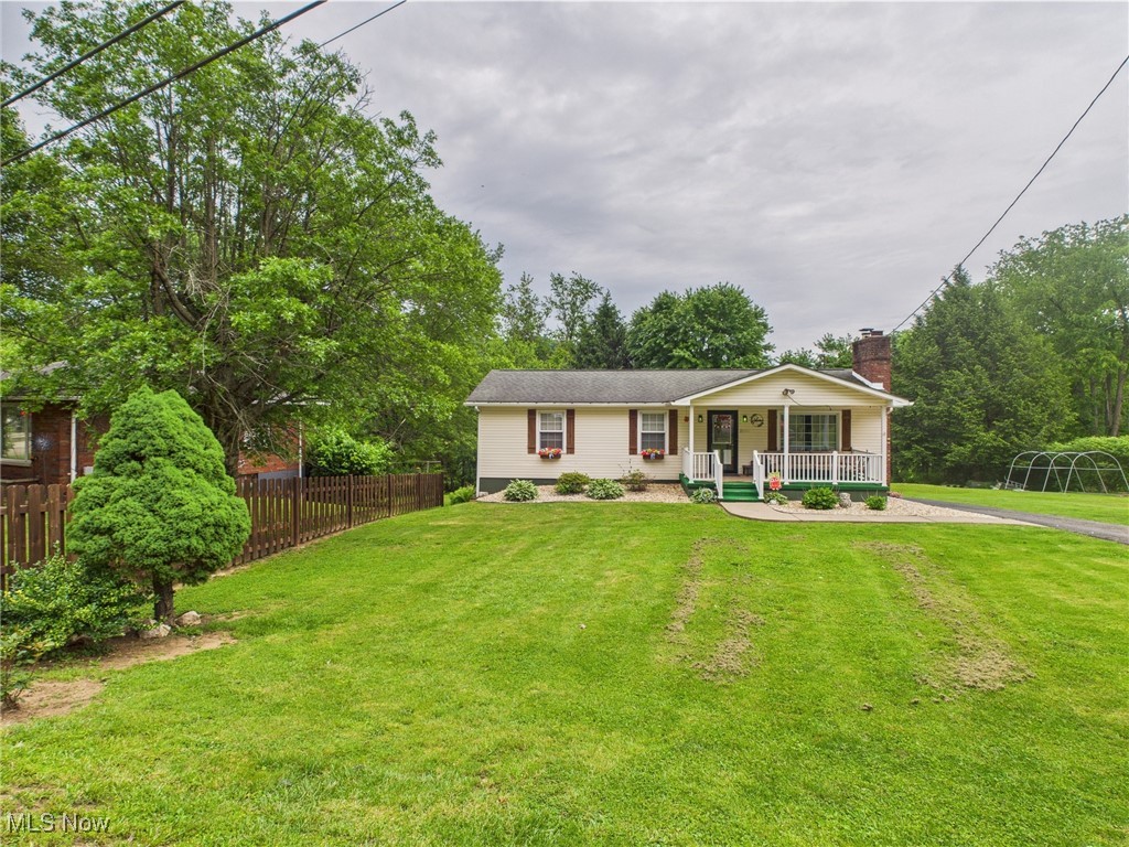 326 Highway 7 Powhatan Point, OH 43942 - Photo 21 of 32 View of front of home featuring a porch and a chimney