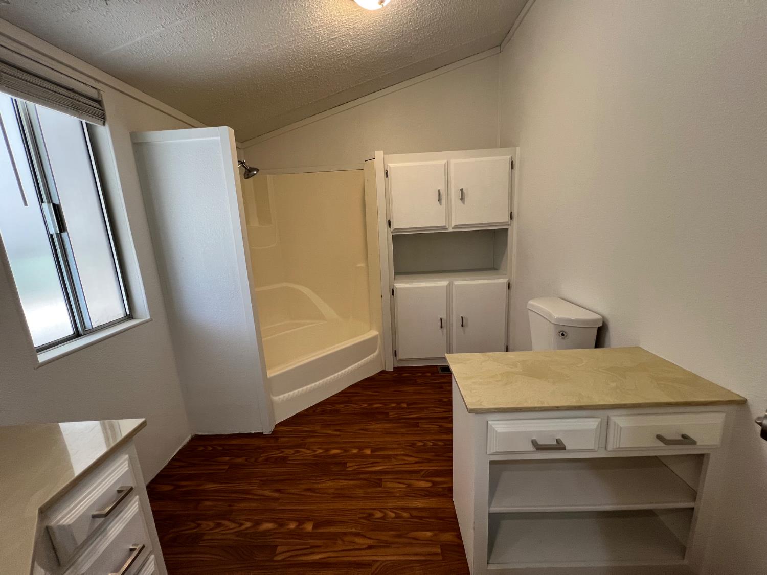 2240 Golden Oak Lane, Unit 134 Merced, CA 95341 - Photo 13 of 29 a bedroom with a bed and a mirror