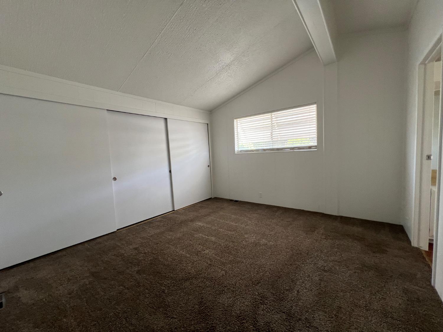 2240 Golden Oak Lane, Unit 134 Merced, CA 95341 - Photo 14 of 29 an empty room with a empty space and window