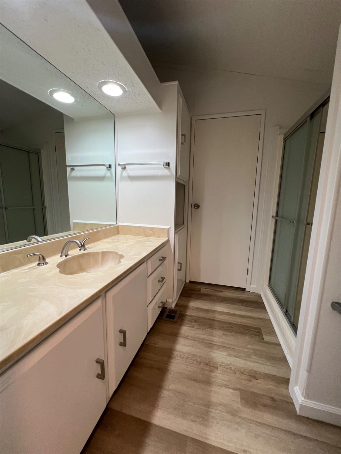 2240 Golden Oak Lane, Unit 134 Merced, CA 95341 - Photo 15 of 29 a bathroom with a sink and a mirror