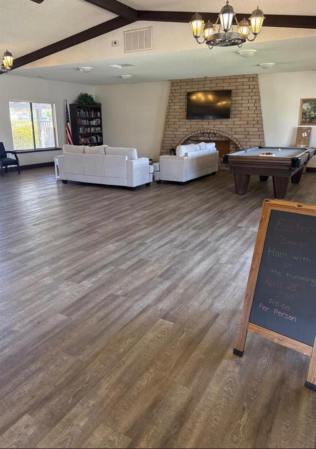 2240 Golden Oak Lane, Unit 134 Merced, CA 95341 - Photo 23 of 29 a living room with furniture and a wooden floor