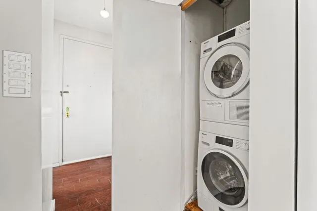 a bathroom with a granite countertop sink mirror vanity and toilet