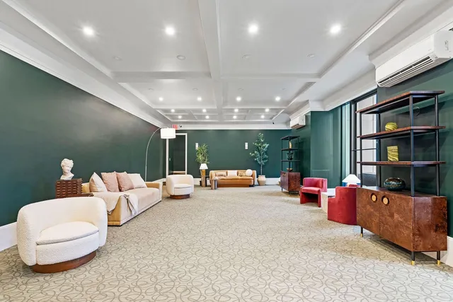 a view of a swimming pool with chairs