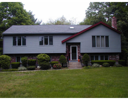 41 Kennedy Road Sharon, MA 02067 - Photo 1 of 1 a front view of a house with a yard and garage