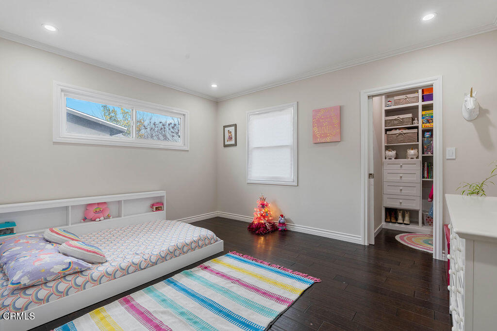 719 North Bradish Avenue San Dimas, CA 91773 - Photo 11 of 22 a bed sitting in a bedroom next to a window