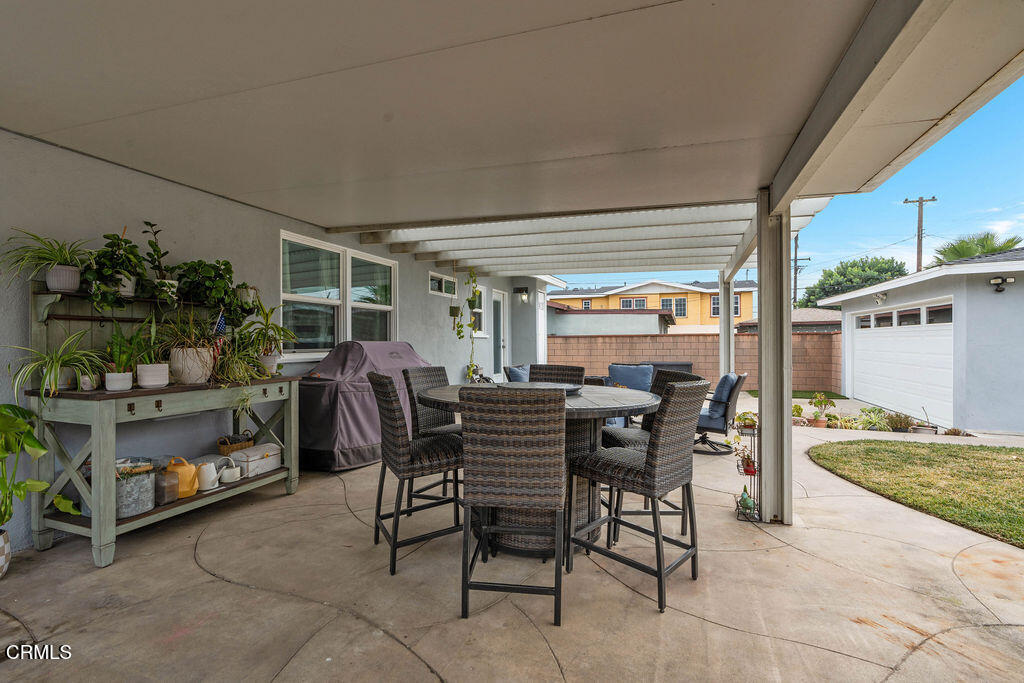 719 North Bradish Avenue San Dimas, CA 91773 - Photo 17 of 22 a view of an outdoor dining space with a table and chairs